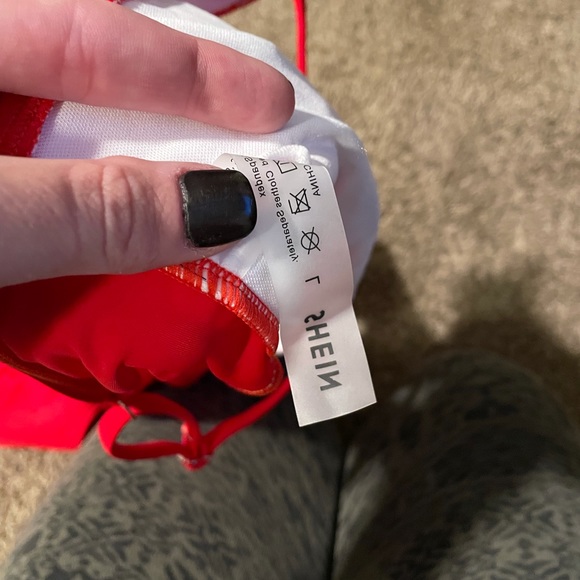 She in red cutout one piece - Picture 4 of 5